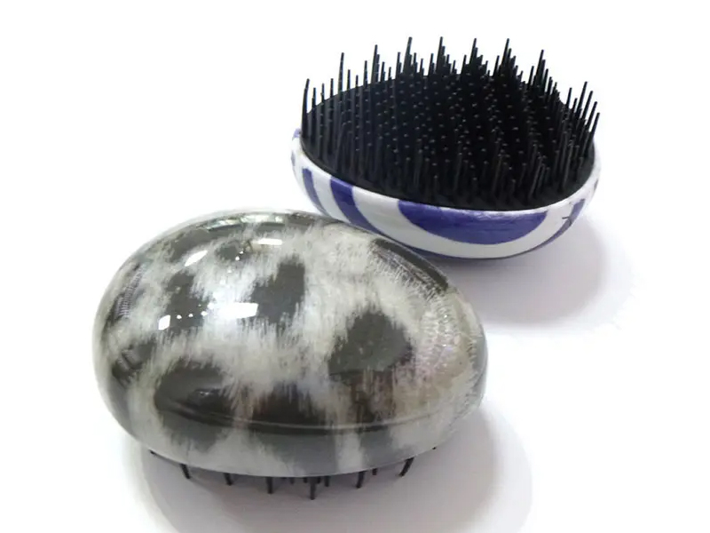Lược du lịch hình quả trứng massage da đầu